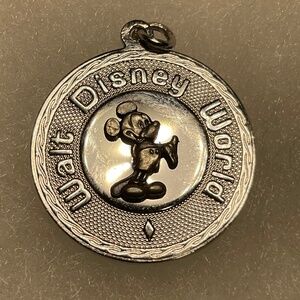 Vintage Sterling Silver Disney World Pendant. 1 inch diameter. Weight 4 grams